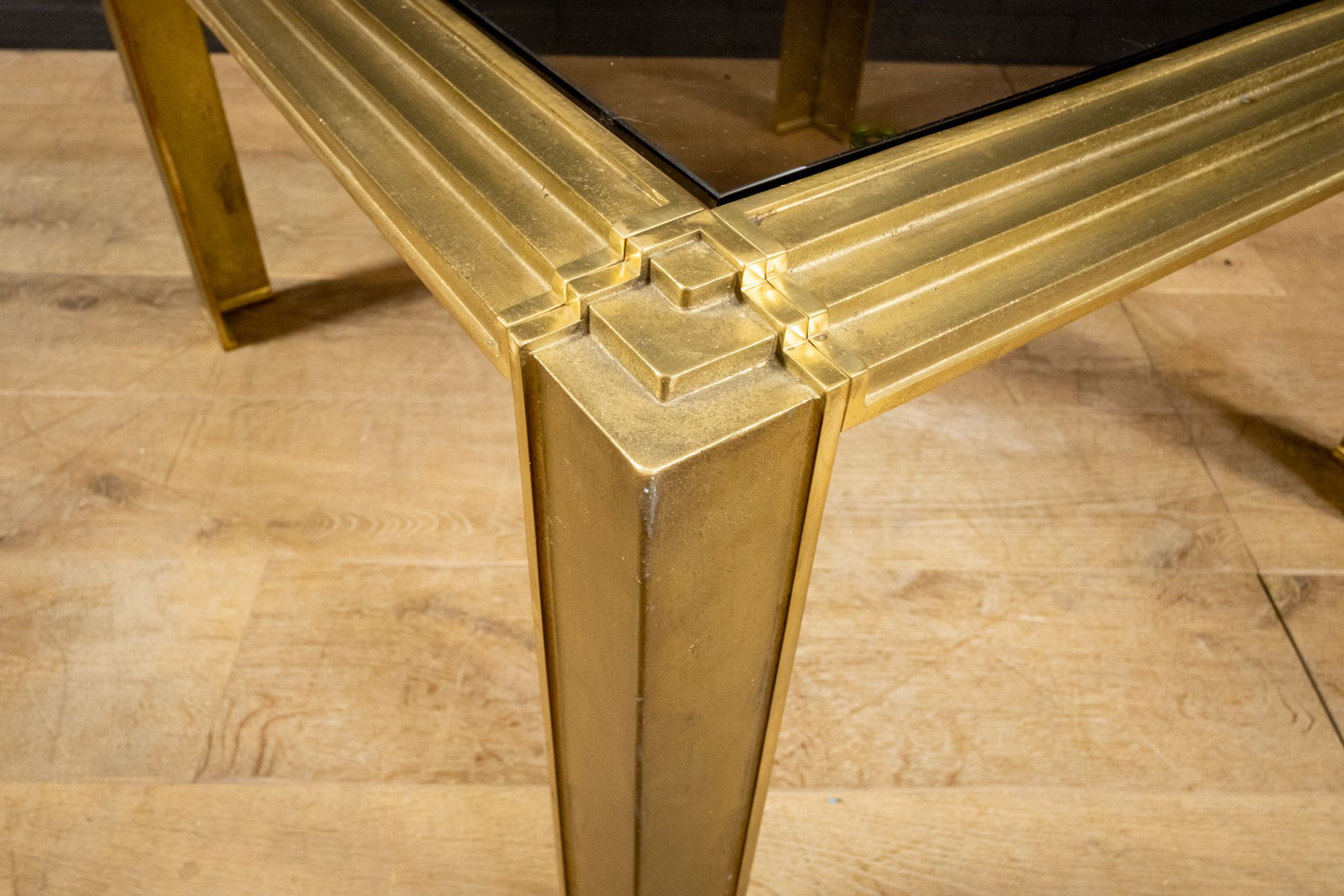 Coffee table made of brass and glass.