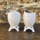 Antique porcelain egg cups in shell shape.