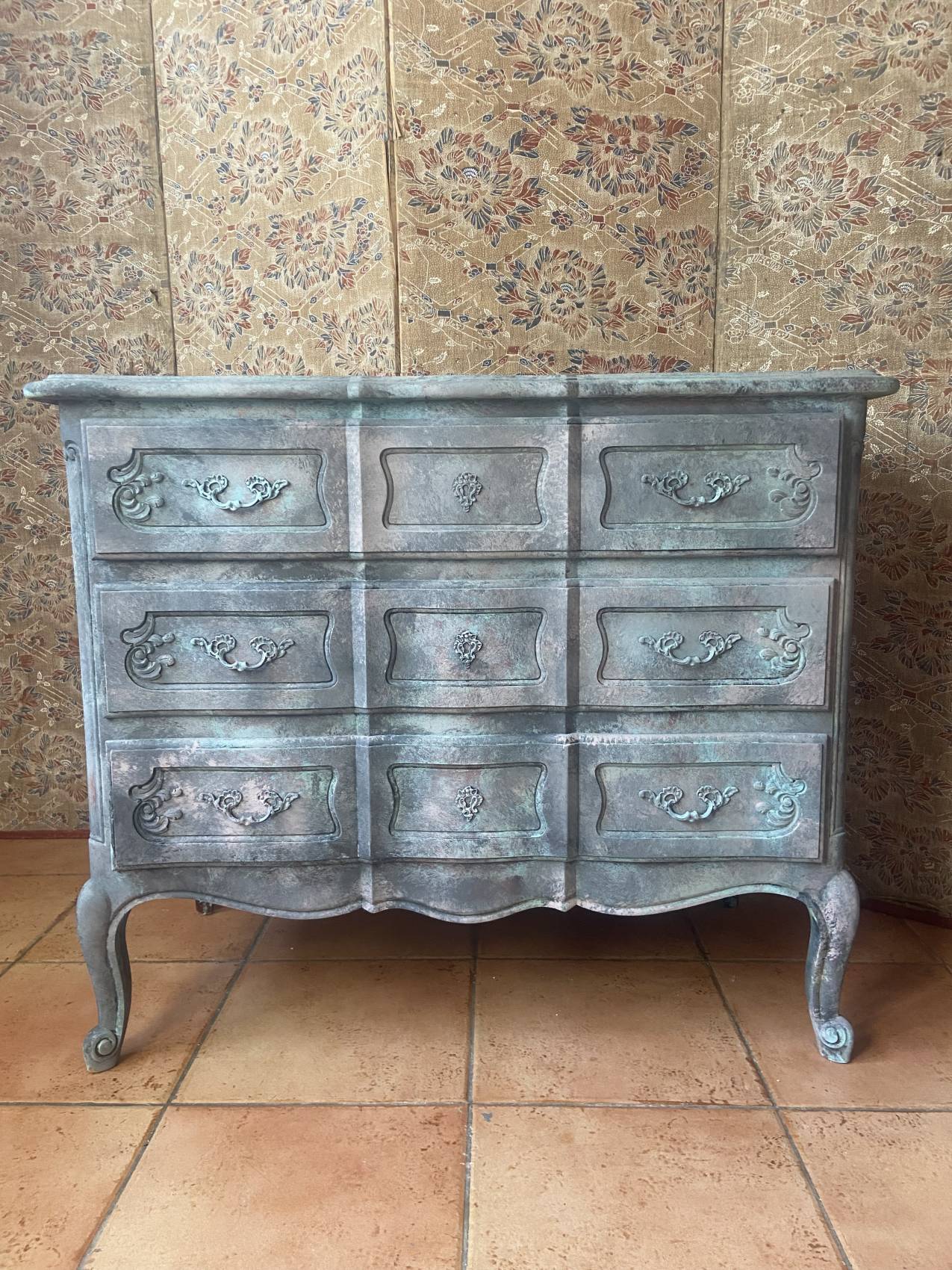 Antique Louis XV style commode, aged finish, practical elegance.