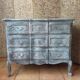 Antique Louis XV style commode, aged finish, practical elegance.
