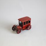 Vintage tin car with pull lever