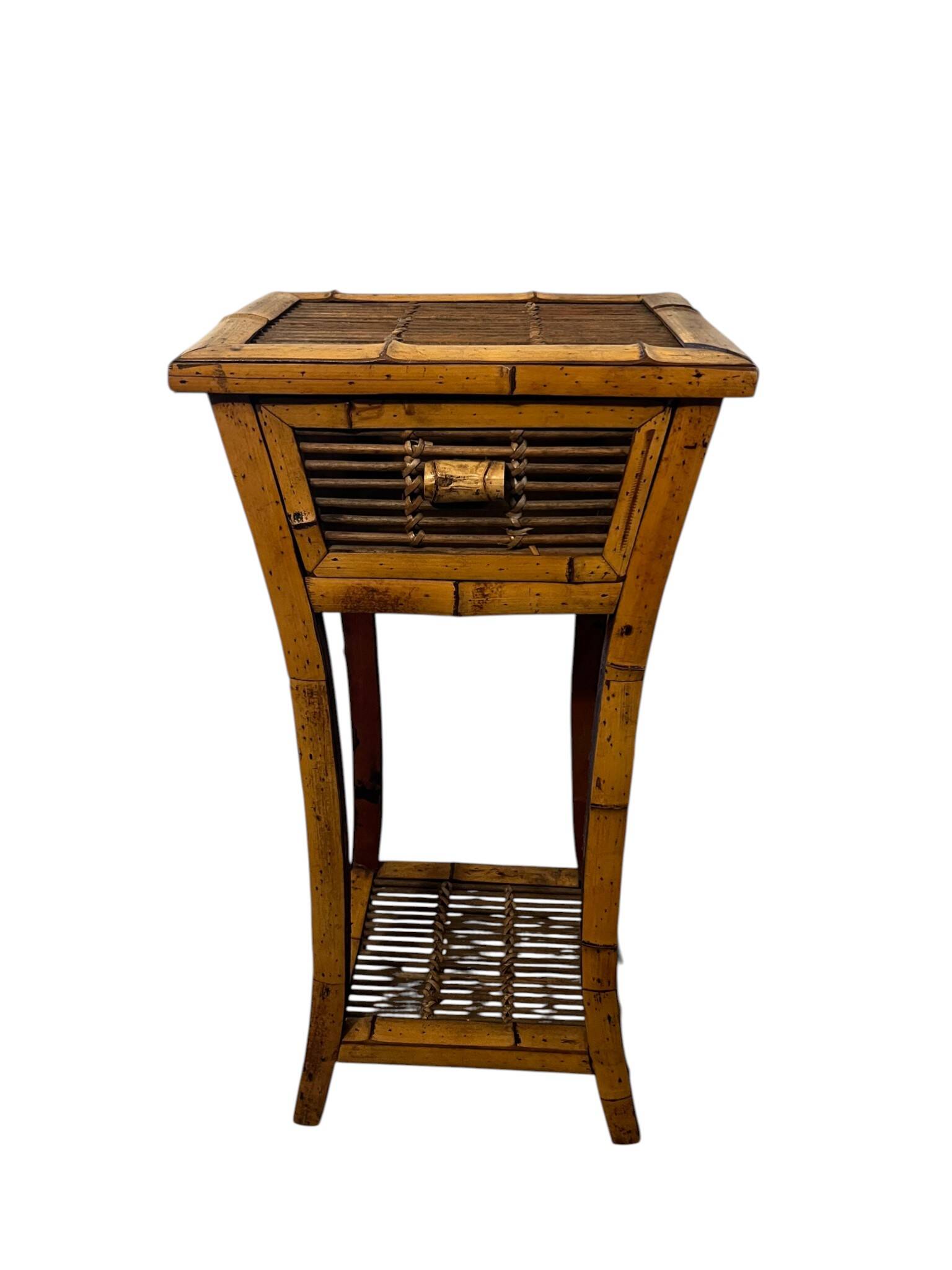 Vintage bamboo side table with drawer from the 20th century.