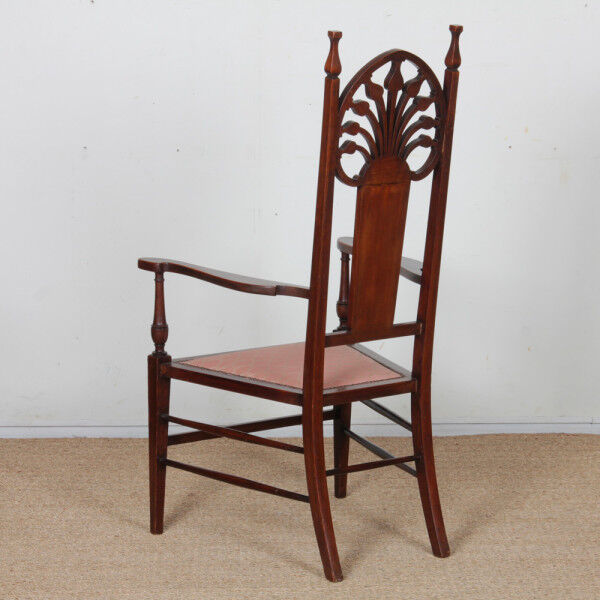 English armchair attributed to J.S. Henry, late 19th century.