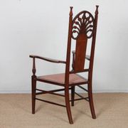 English armchair attributed to J.S. Henry, late 19th century.