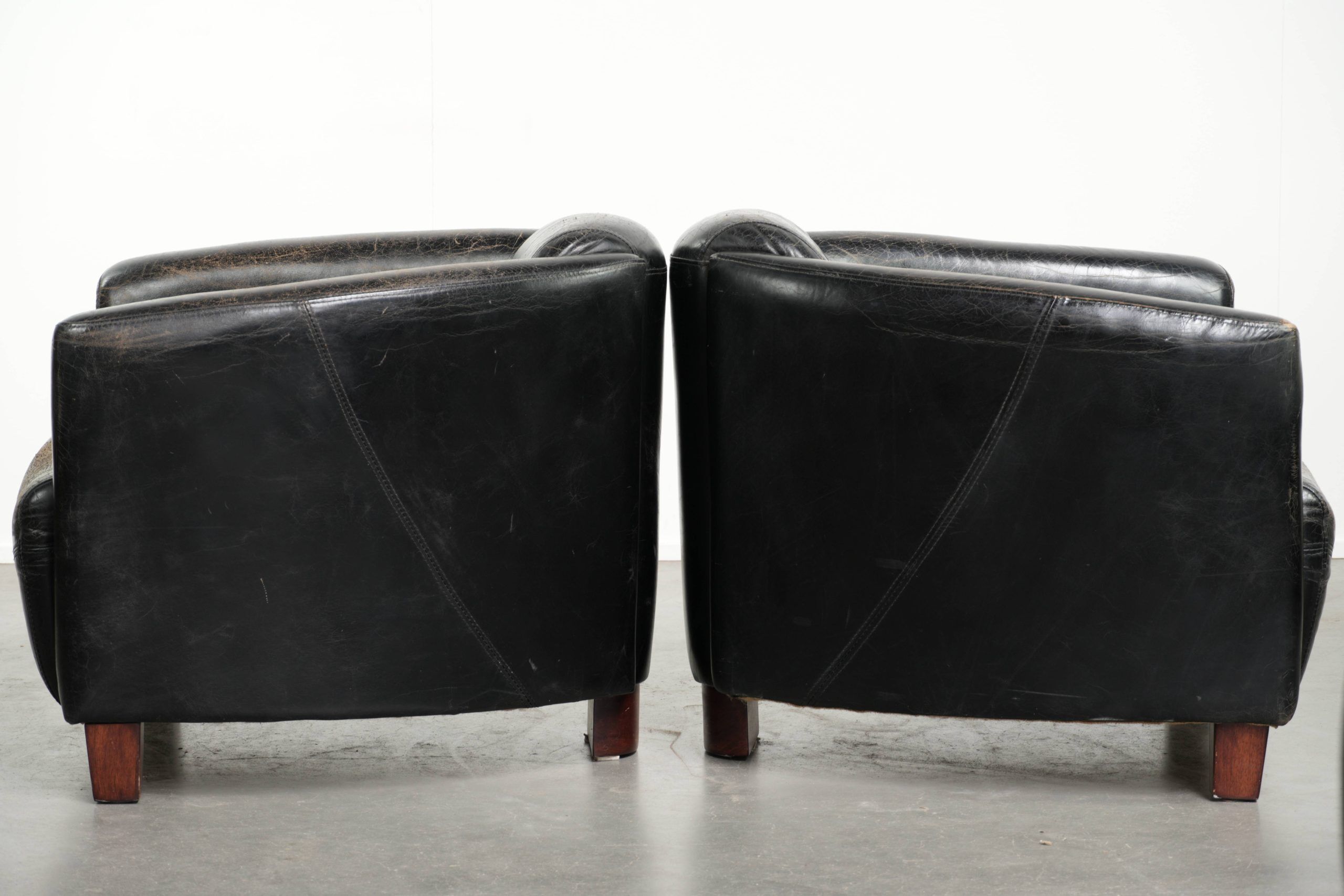 Set of two black vintage cowhide aviator design armchairs