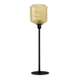 Table lamp with a yellow shade in vintage art deco style