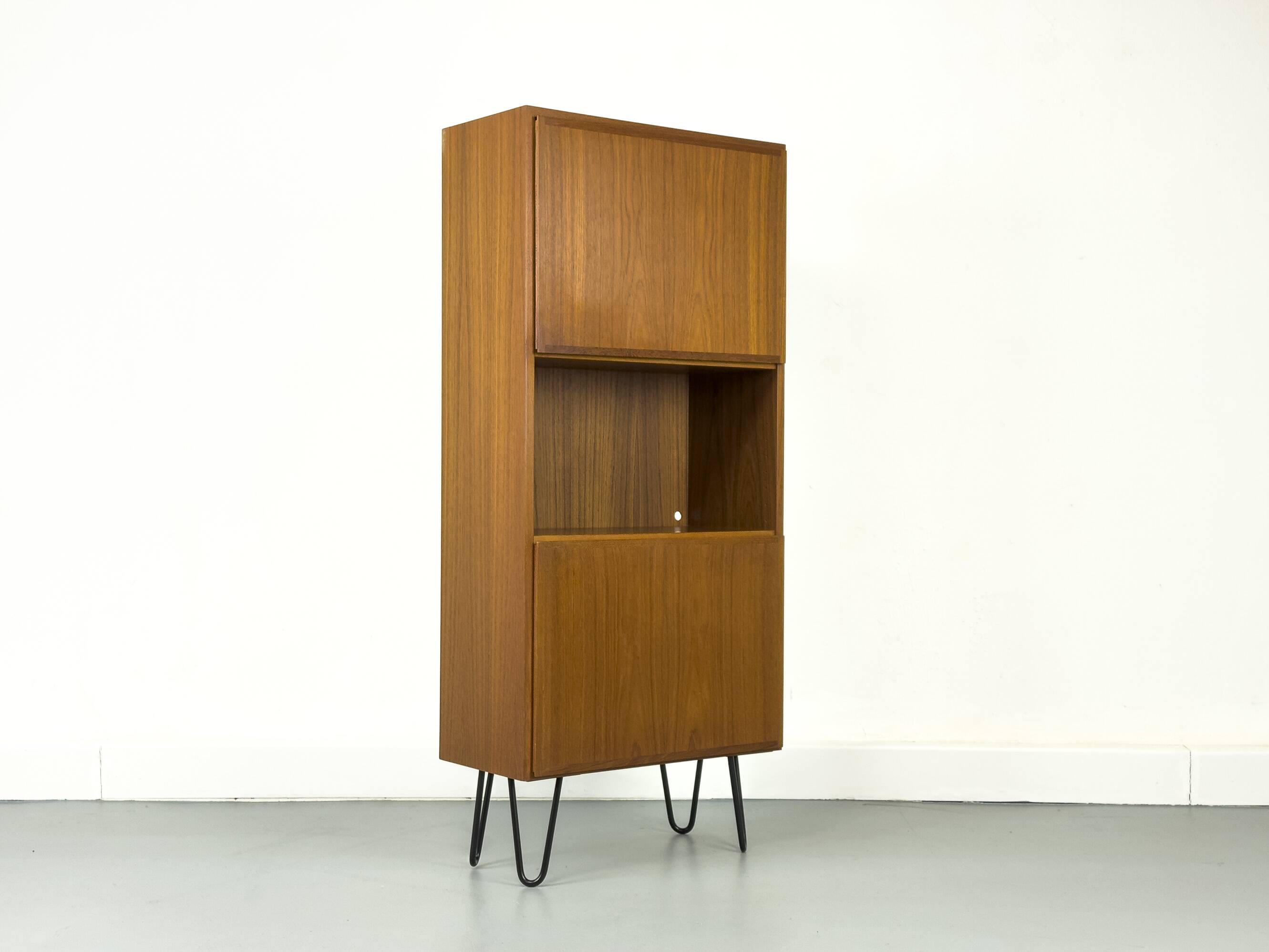 Narrow teak bookcase with two doors by Omann Jun, 1970s