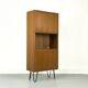 Narrow teak bookcase with two doors by Omann Jun, 1970s