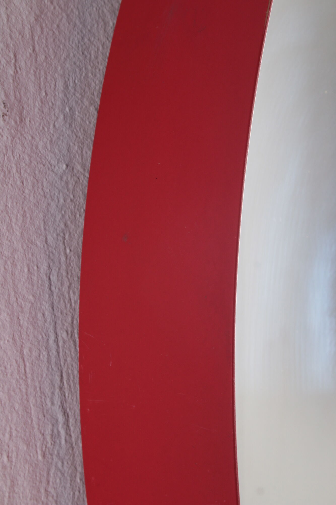 Vintage red round plastic mirror from the 1960s.