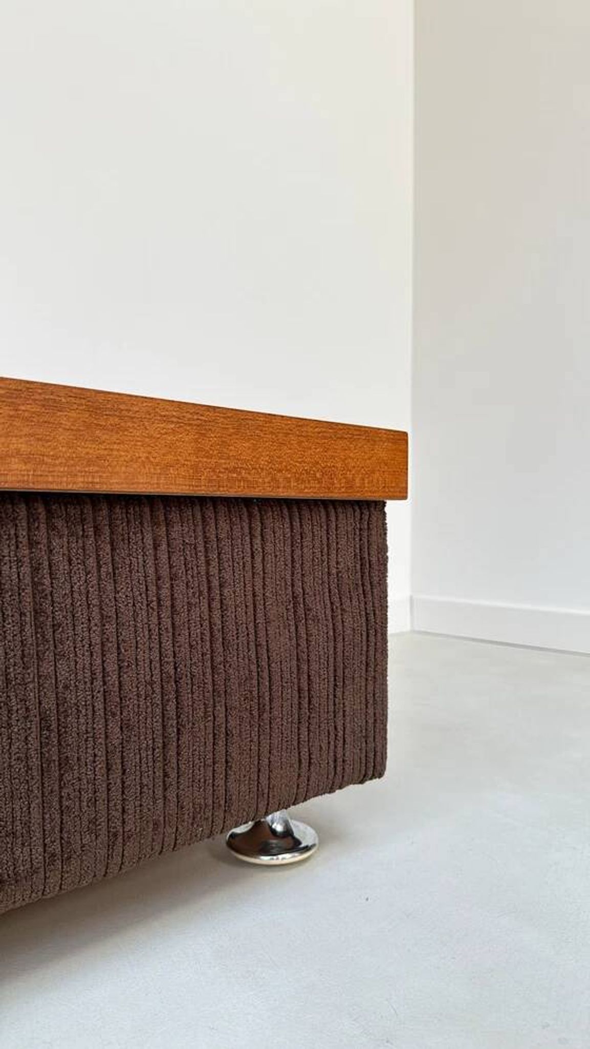 Coffee table with brown corduroy fabric, wooden top and chrome legs
