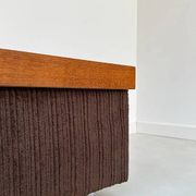 Coffee table with brown corduroy fabric, wooden top and chrome legs