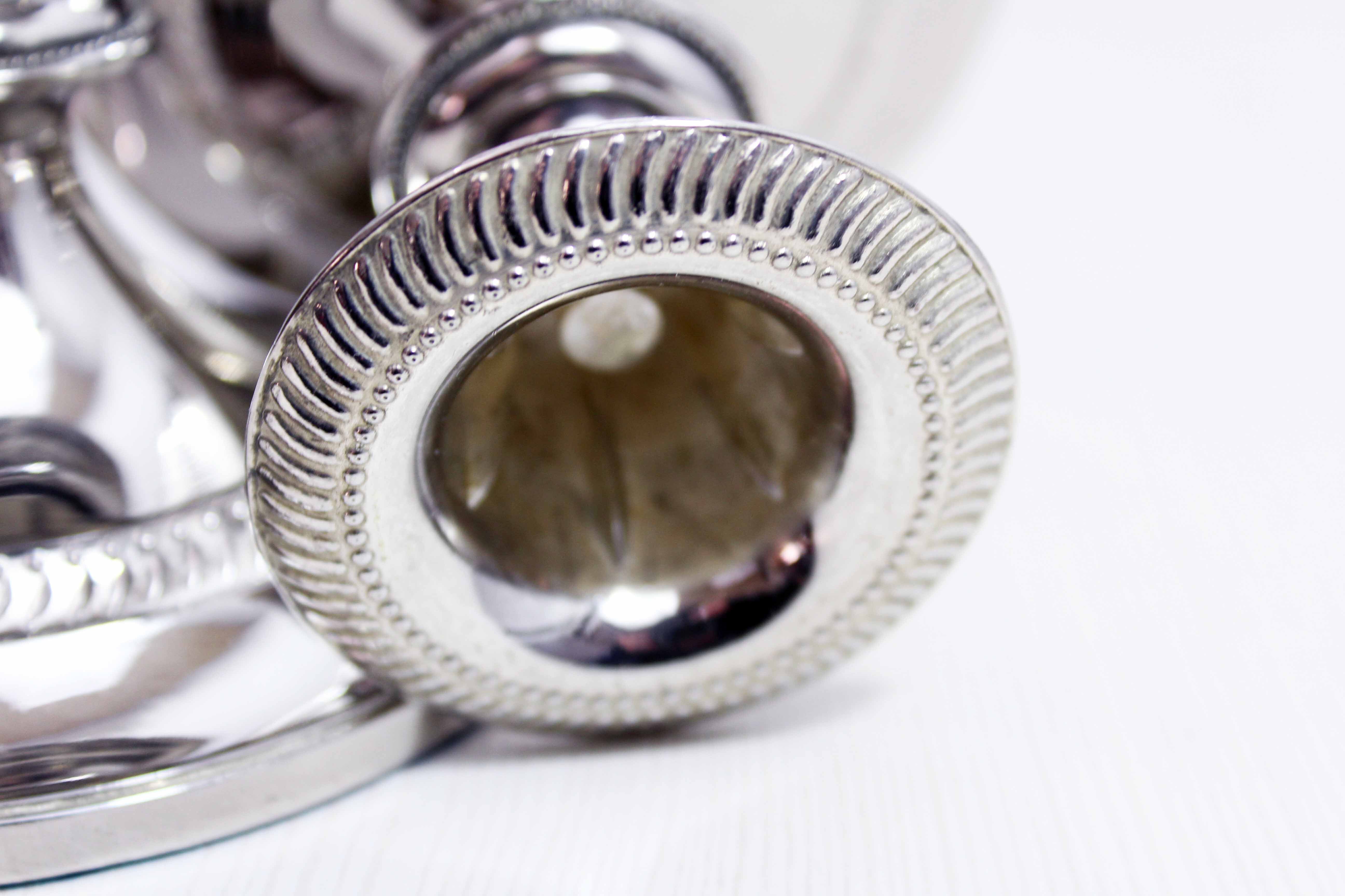 Pair of silver metal candle holders