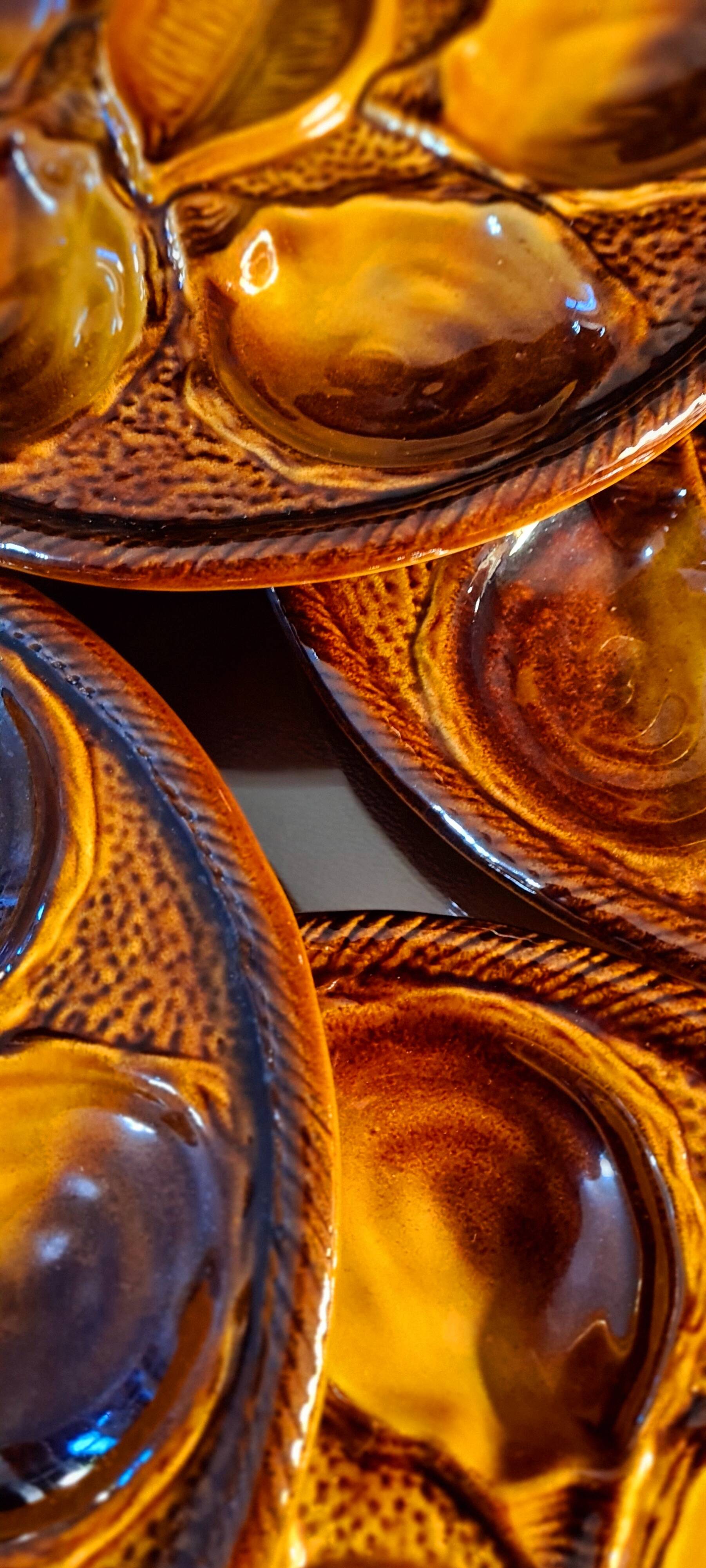 Six oyster plates signed Saint Clément