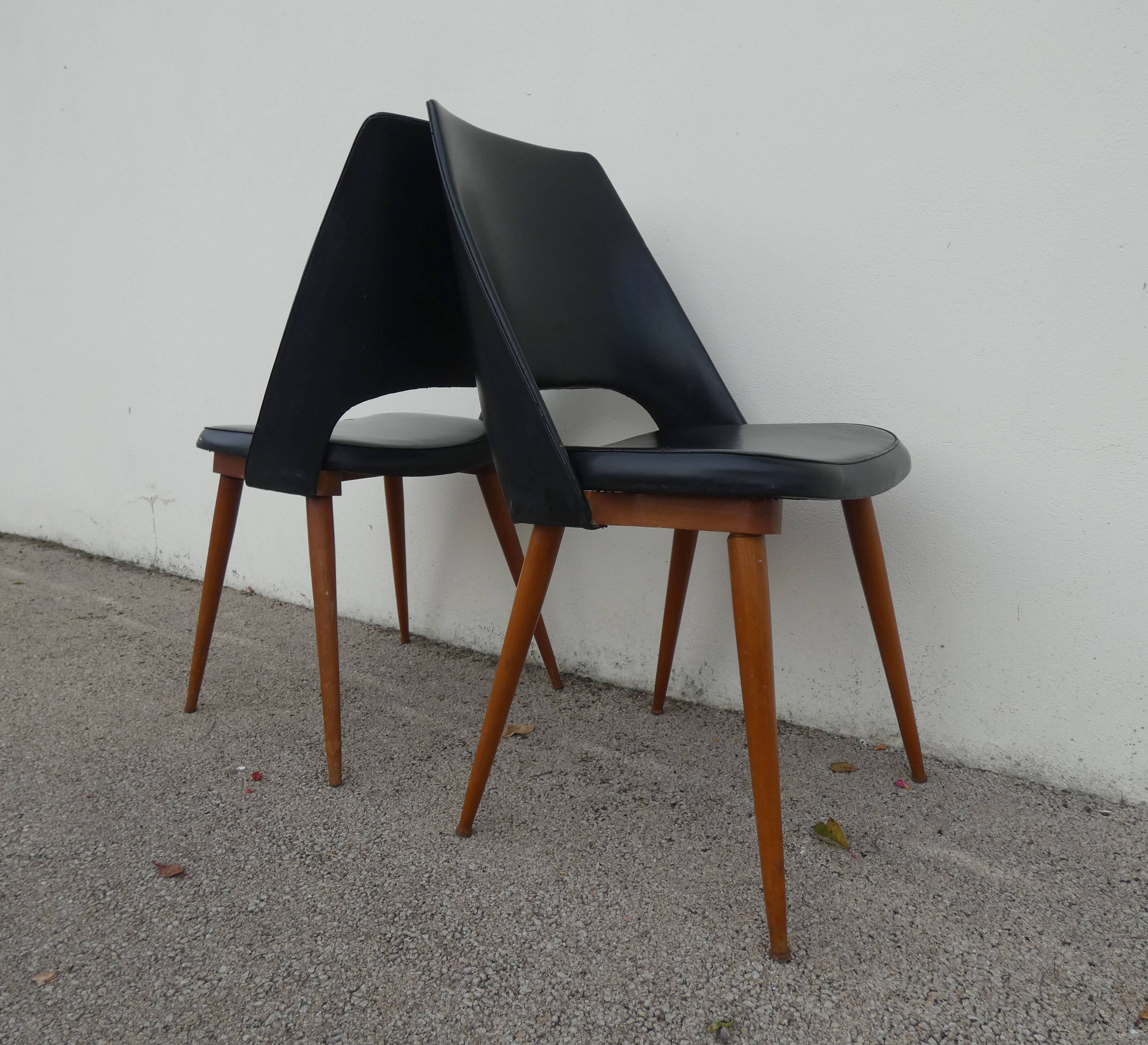 2 chairs in black skai compass legs Louis Paolozzi