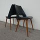 2 chairs in black skai compass legs Louis Paolozzi