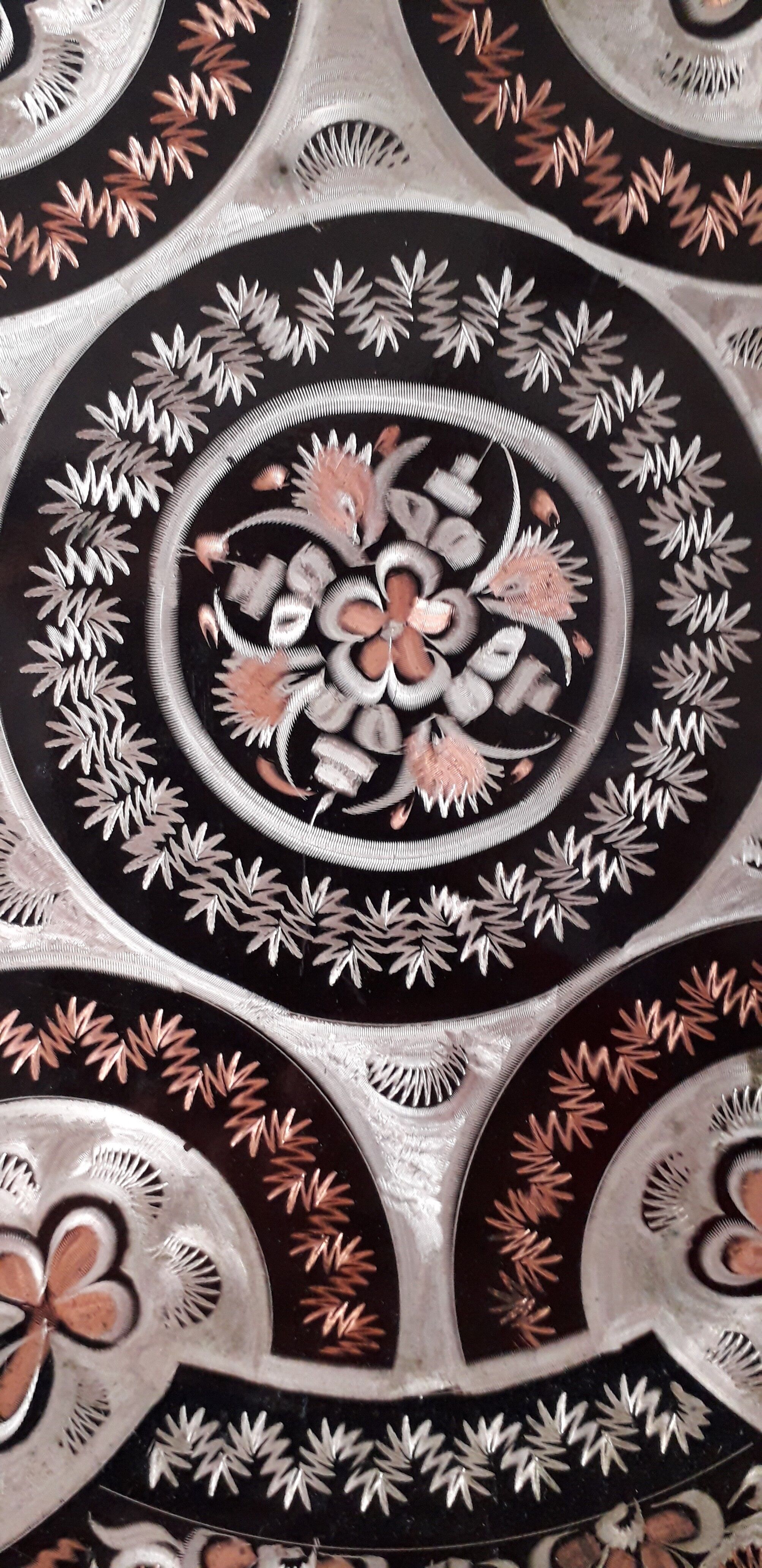 Oriental dish in chiseled red copper