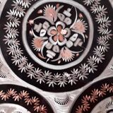 Oriental dish in chiseled red copper