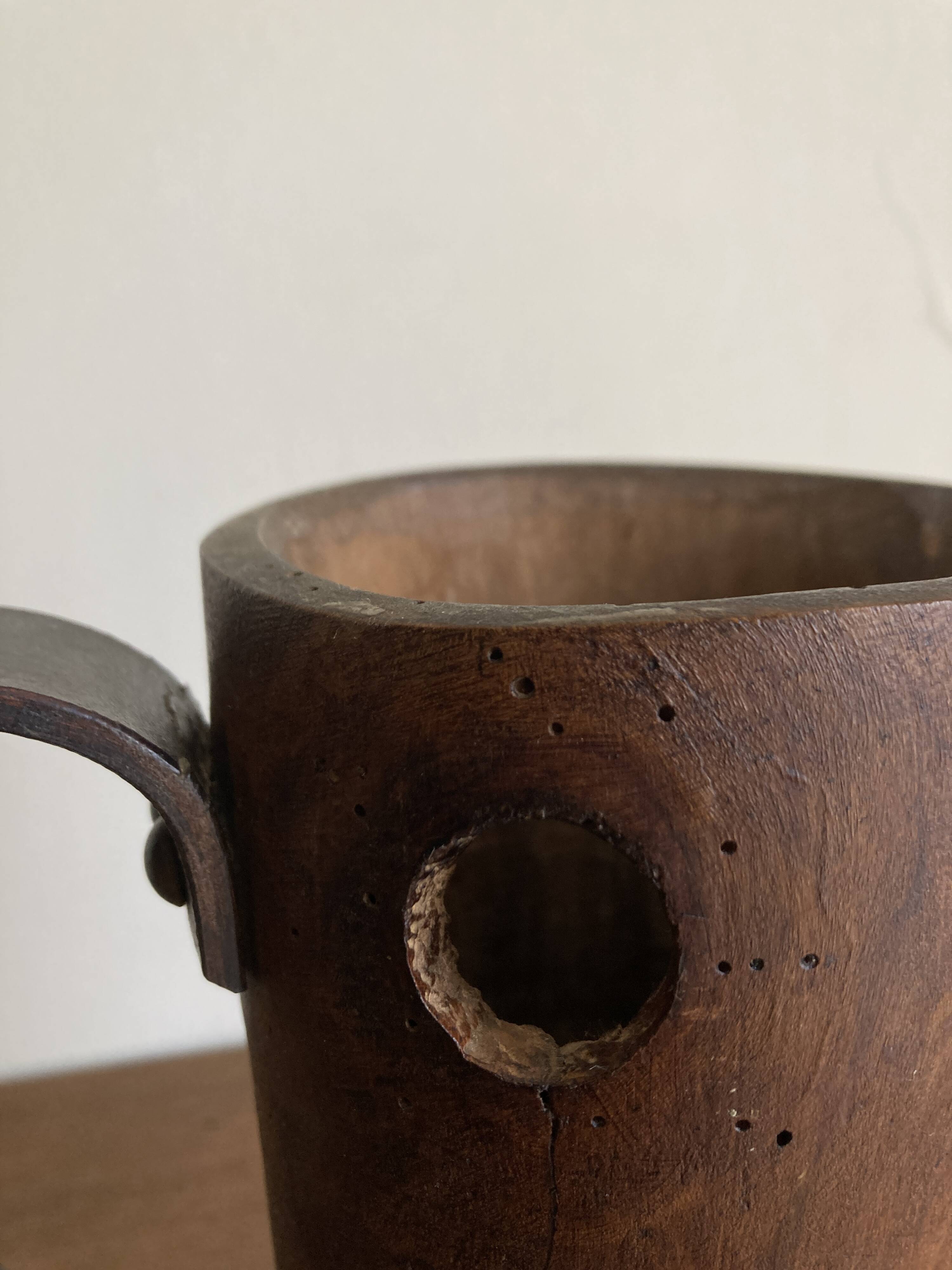 Mountain pitcher in monoxile wood and leather folk art