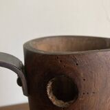 Mountain pitcher in monoxile wood and leather folk art
