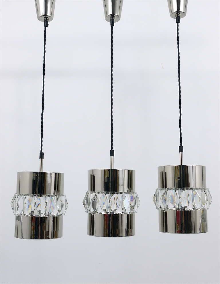 Three Bakalowits pendant lamps in nickel, brass, and faceted crystal, Austria, 1950s.
