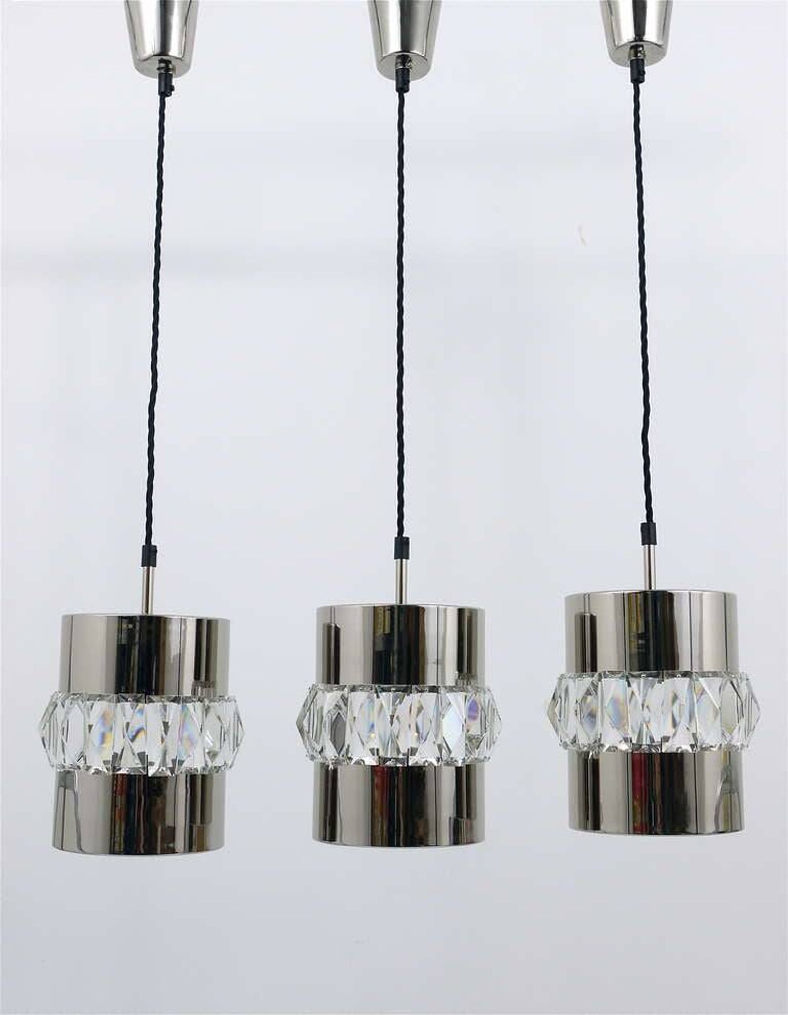 Three Bakalowits pendant lamps in nickel, brass, and faceted crystal, Austria, 1950s.