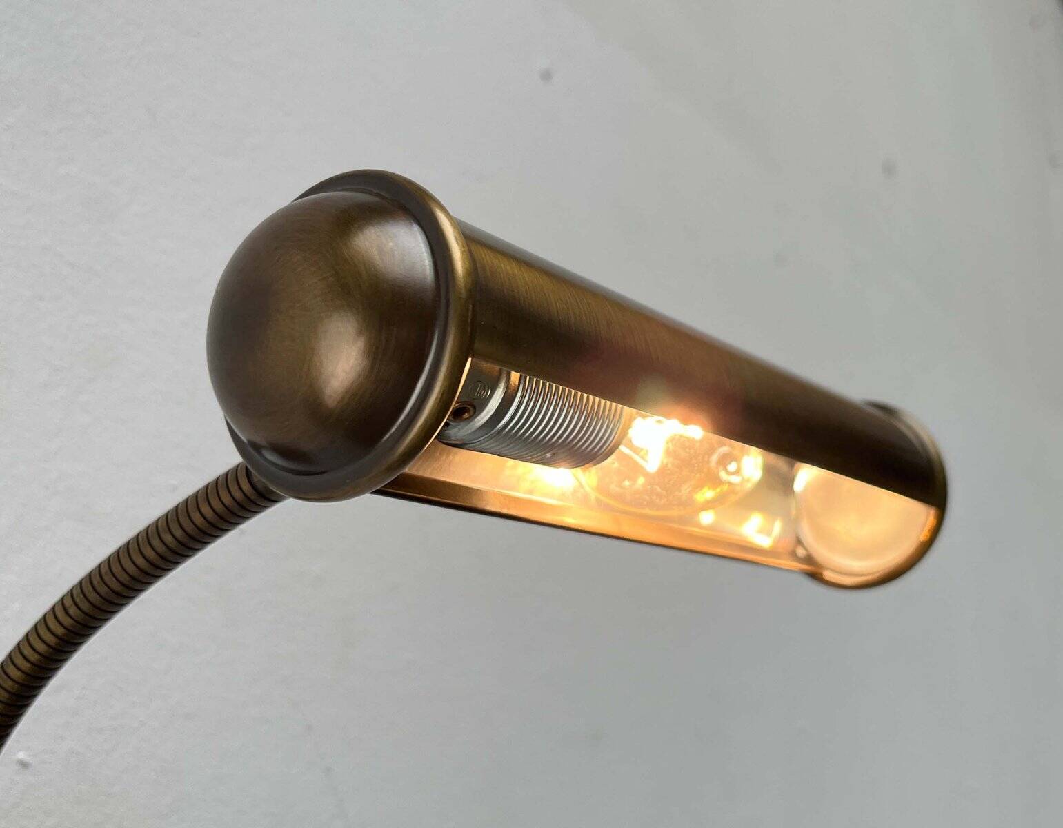 Vintage German brass patinated wall lamp with a gooseneck design by Honsel, 1970s.