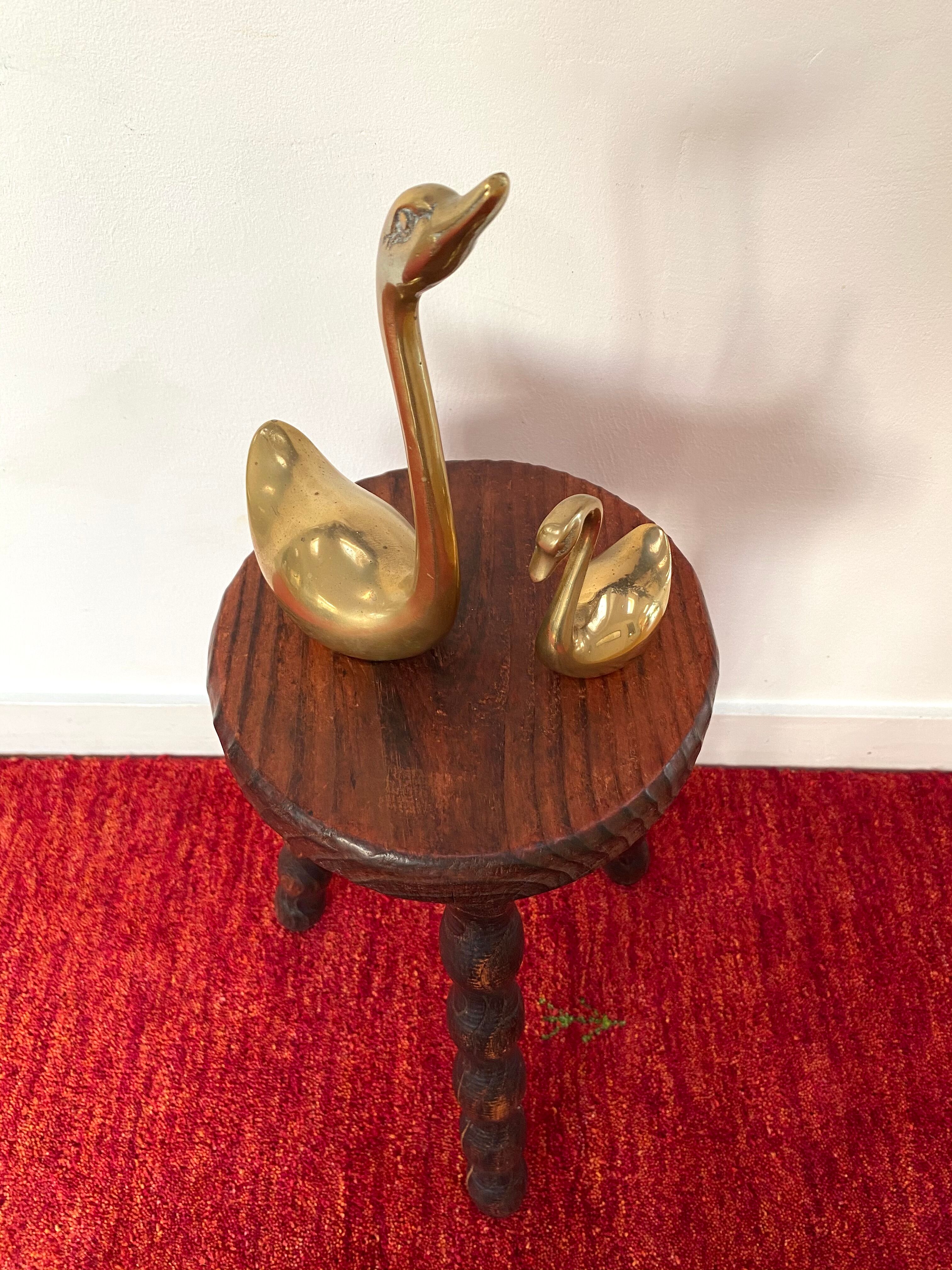 Old tripod stool in solid wood