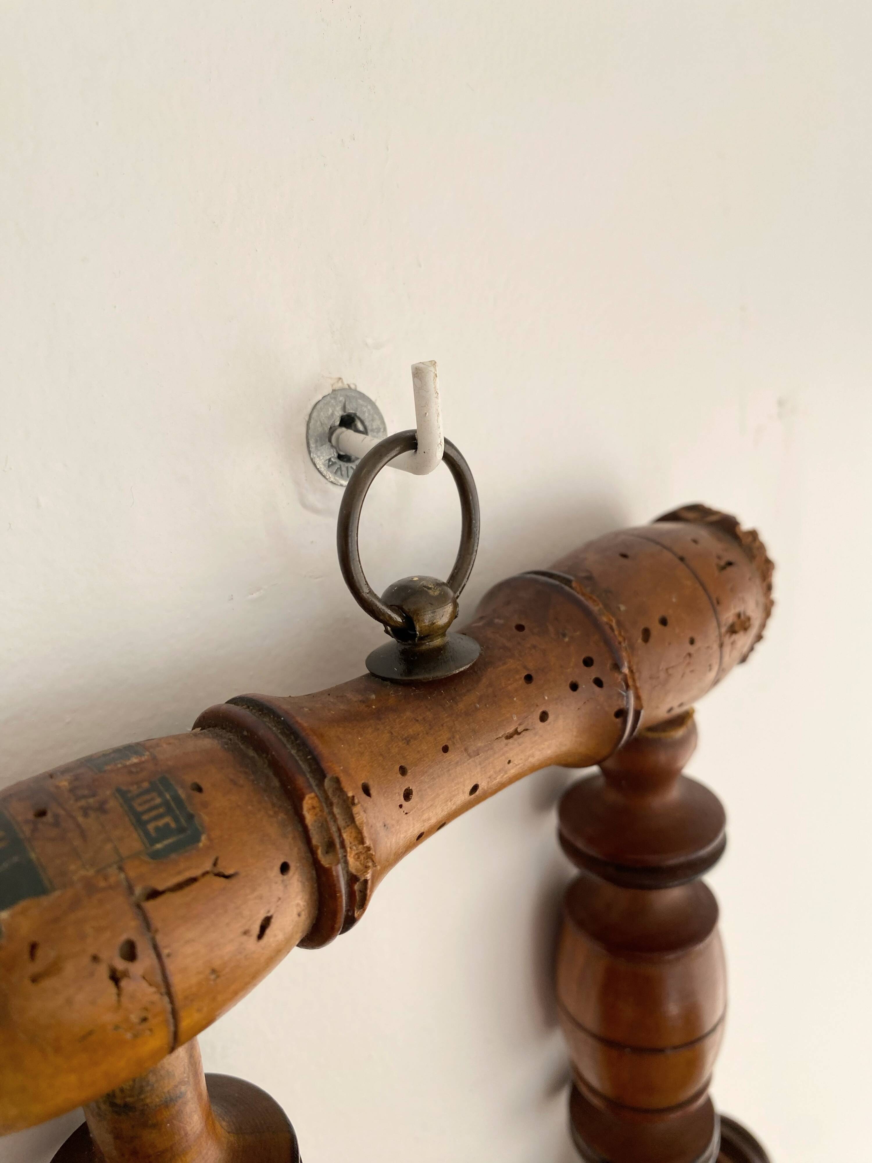 Vintage wooden wall coat rack with 4 swivel hooks from 1920
