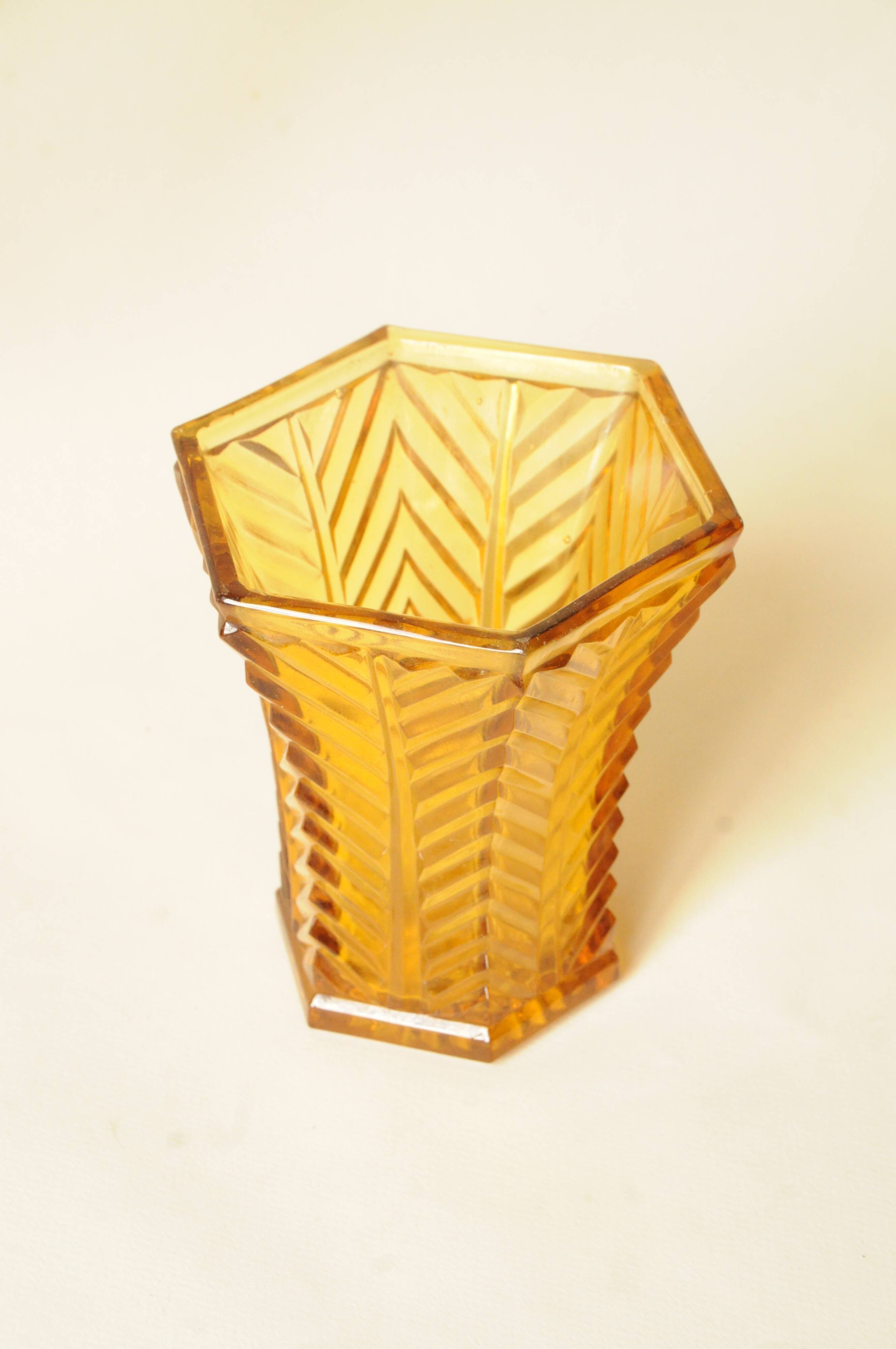 Vintage Art Deco vase in amber yellow cut glass with geometric design.