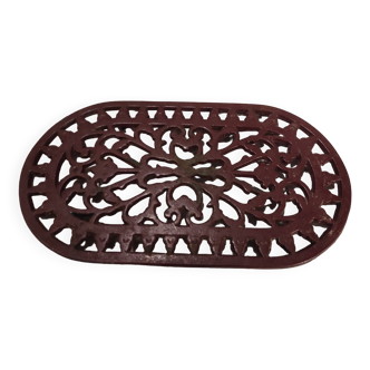 Vintage oval dark red cast iron trivet