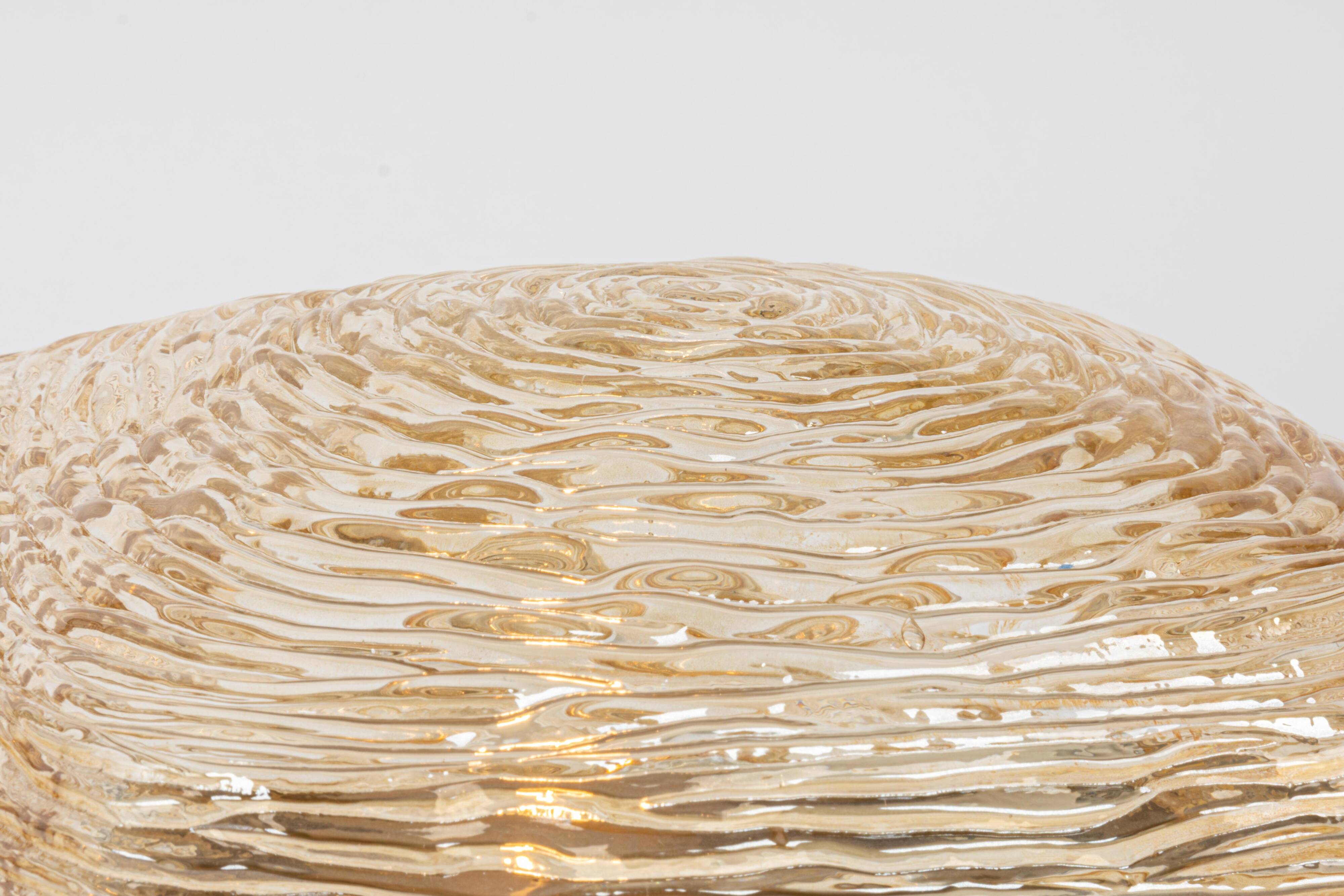 Pairs of amber glass wall lights in the shape of a fingerprint, Germany, 1970s.