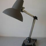 Super Chrome old articulated metal desk lamp on workshop decor base