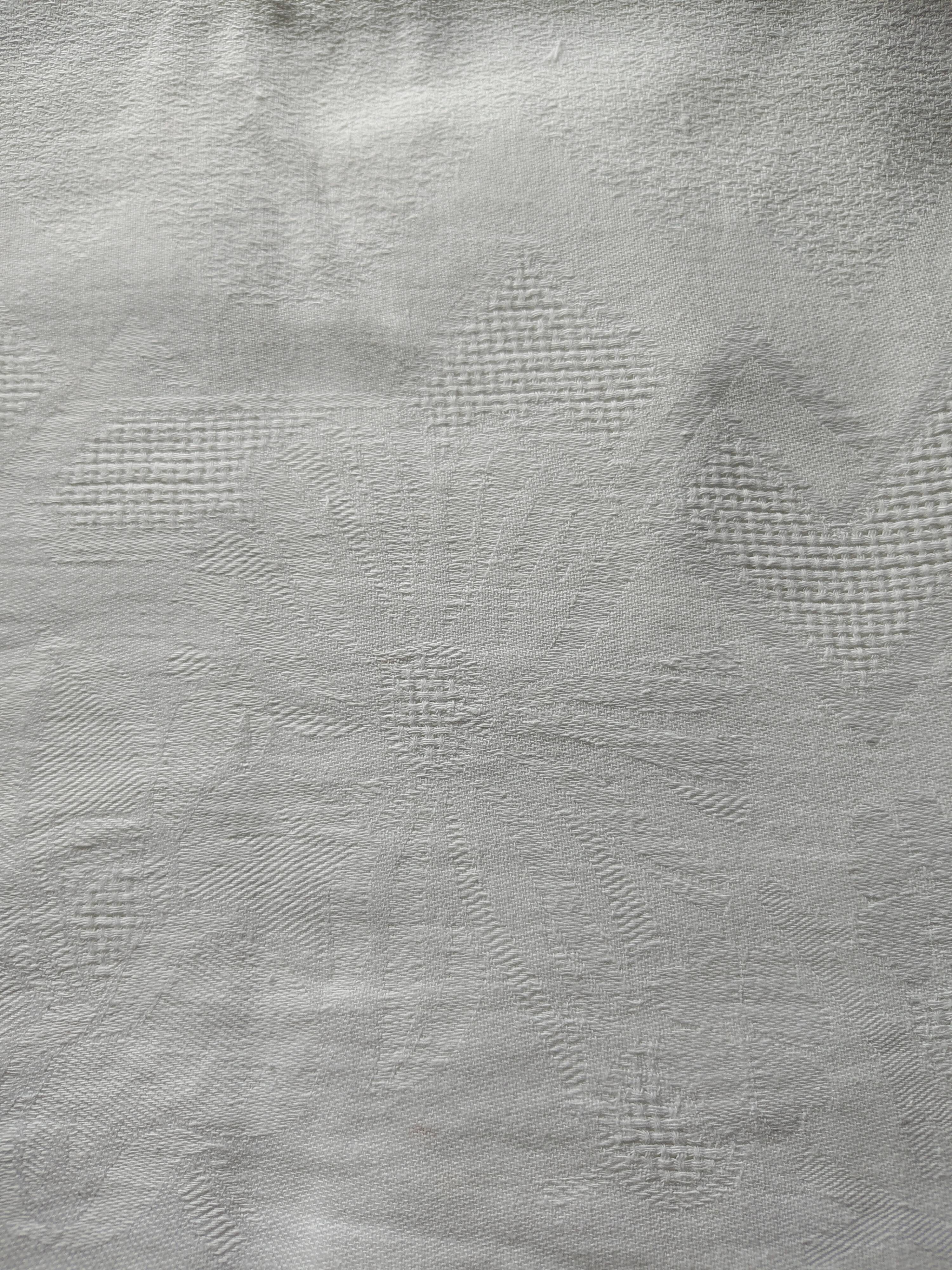 Old white damask cotton tablecloth