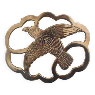 Brass bird trivet