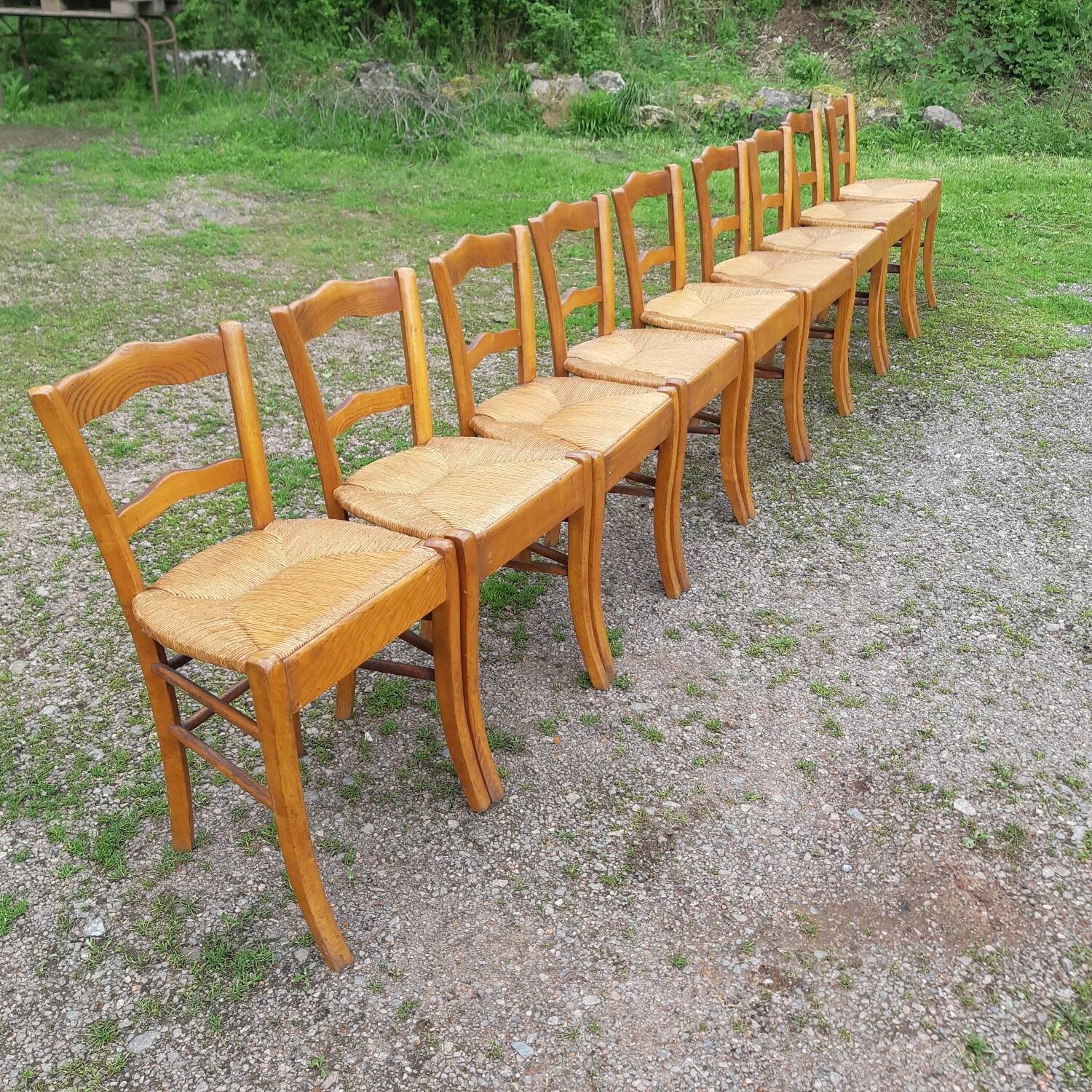 Suite of 9 straw chairs