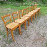 Suite of 9 straw chairs