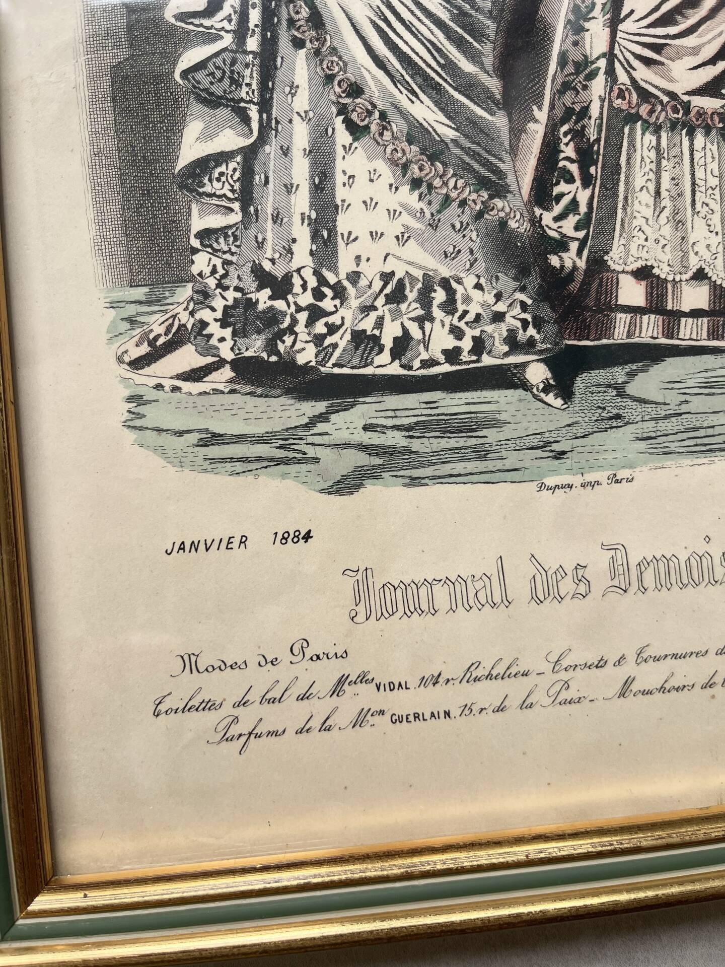 Pair of framed fashion engravings from the 19th century.