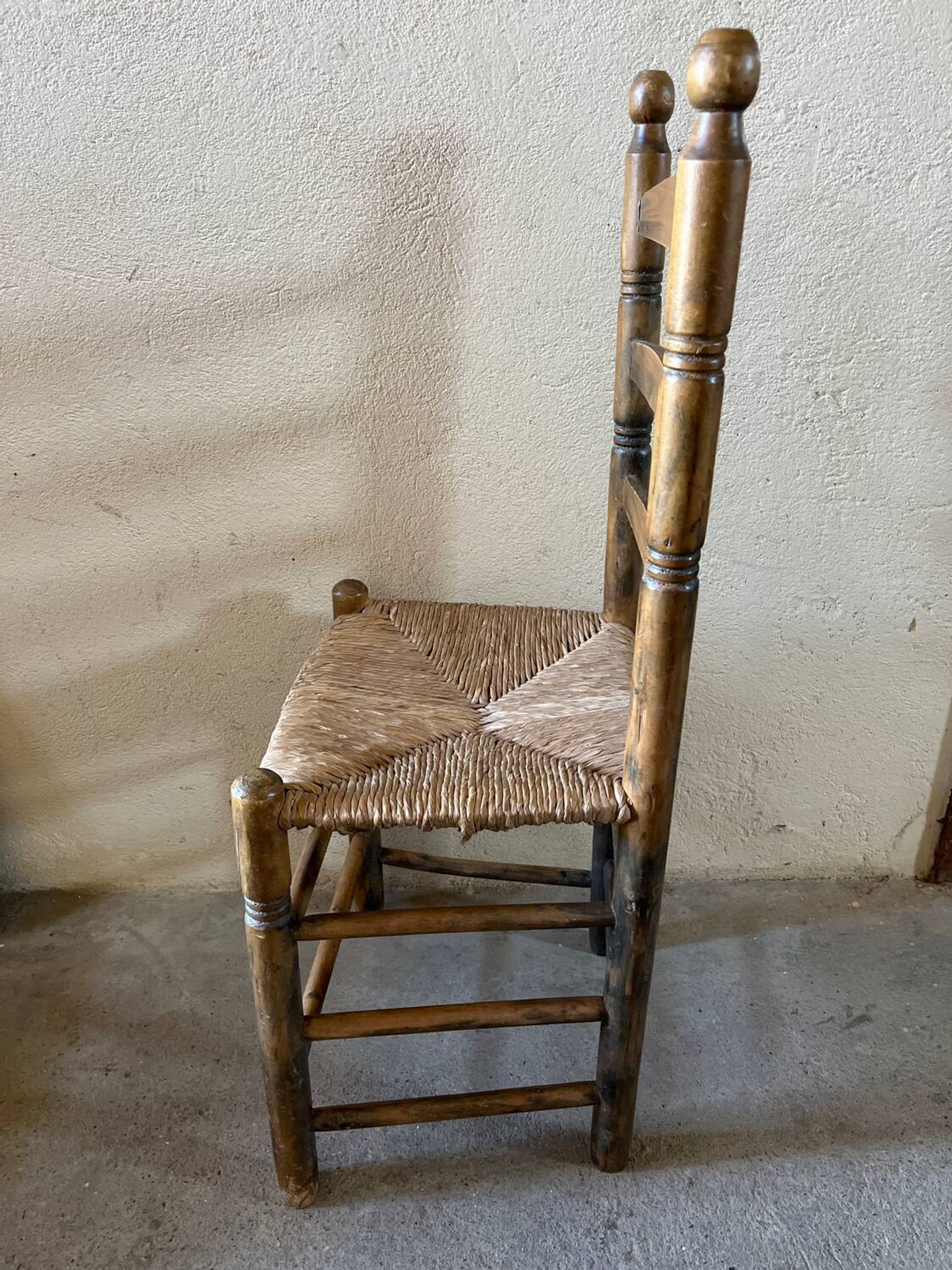 Old turned and stuffed wooden chair