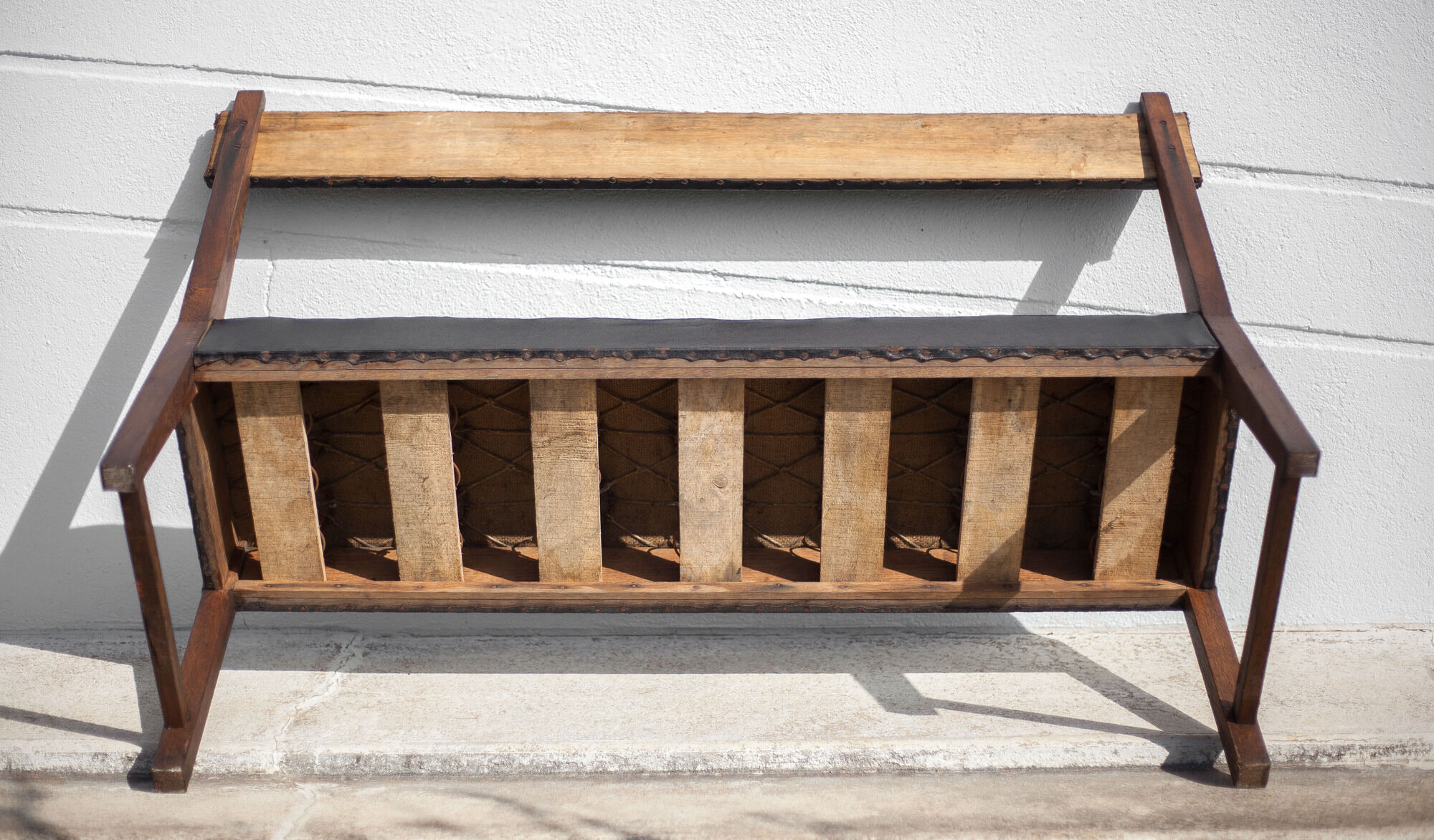 Antique wood bench and black imitation leather