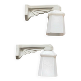 Pair of Art Deco wall sconces in ceramic with opaline glass shades.
