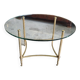 Table basse plateau verre rond et pieds laiton