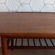 Danish 1960s teak coffee table with slatted shelf.