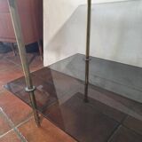 Smoked glass and brass coffee table from the 1970s.