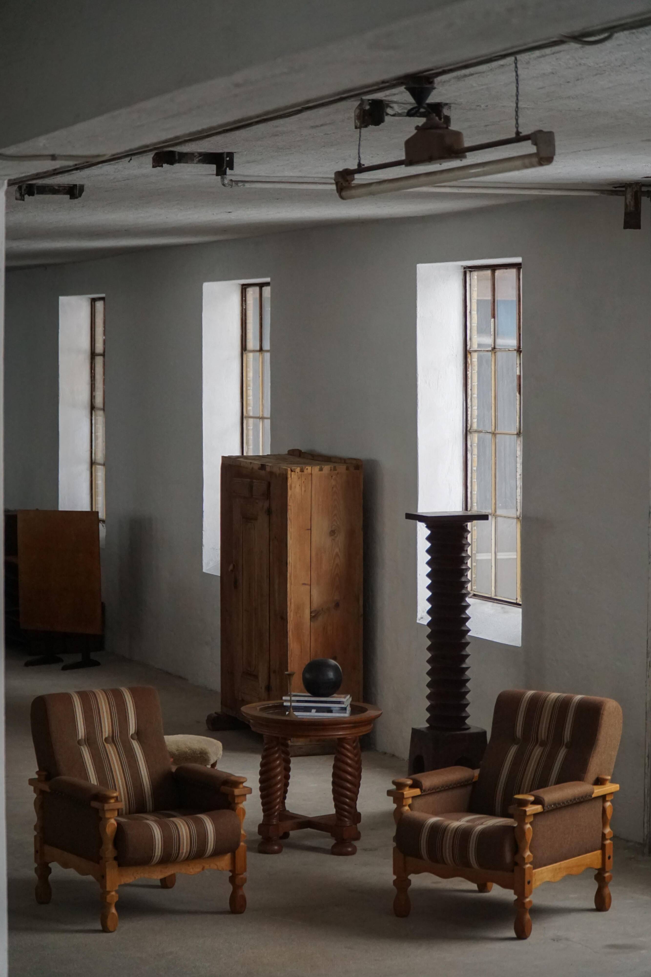 Modern Danish, a pair of lounge chairs in oak and wool, Henning Kjærnulf, 1960s.
