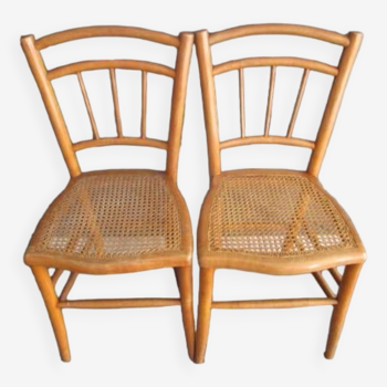 Pair of old caned chairs in blond wood