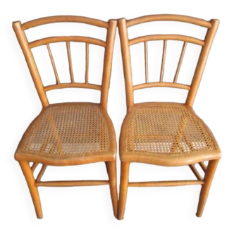 Pair of old caned chairs in blond wood