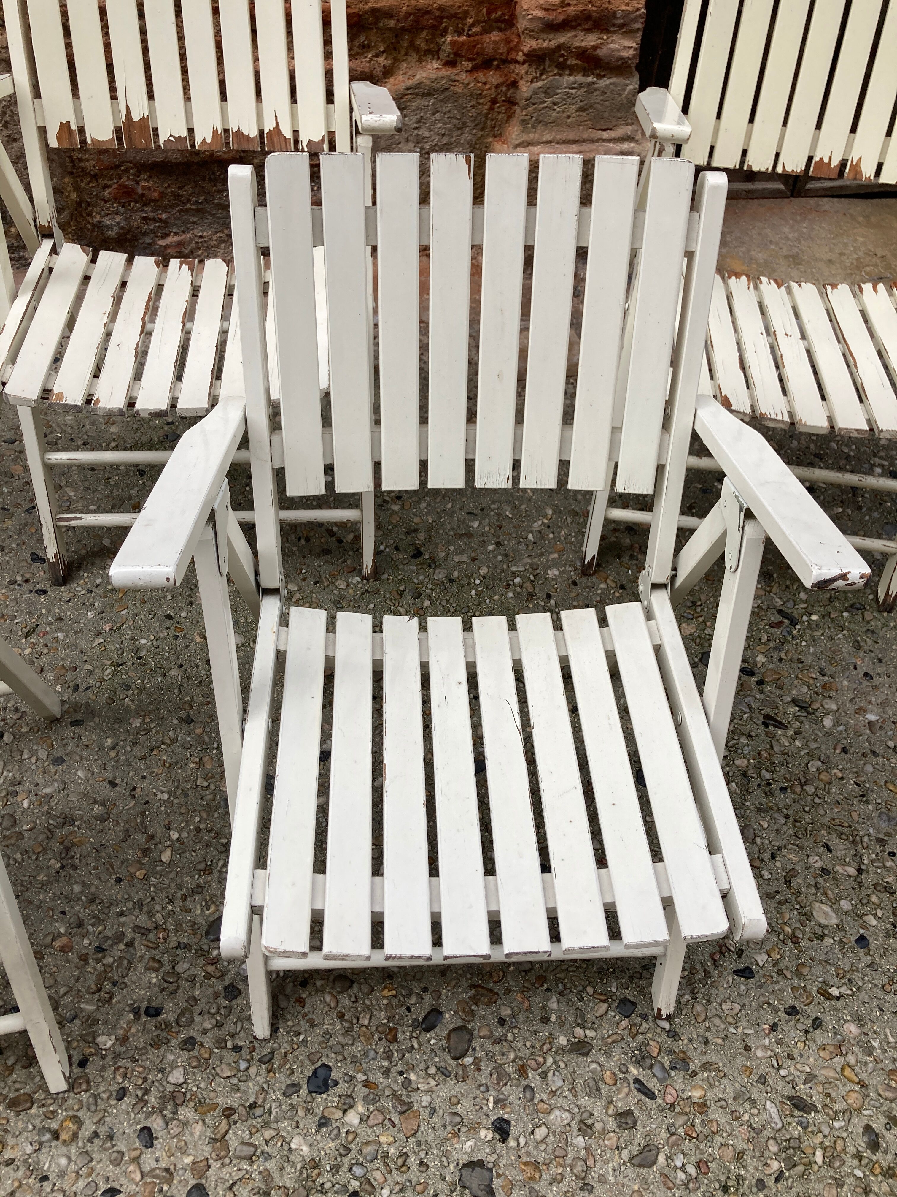 Five wooden garden armchairs