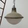 Patinated metal and glass Holophane pendant light