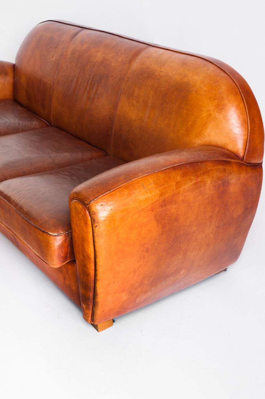 Vintage leather club sofa. Art Deco style. France, 1950s. (sofa convertible into bed)