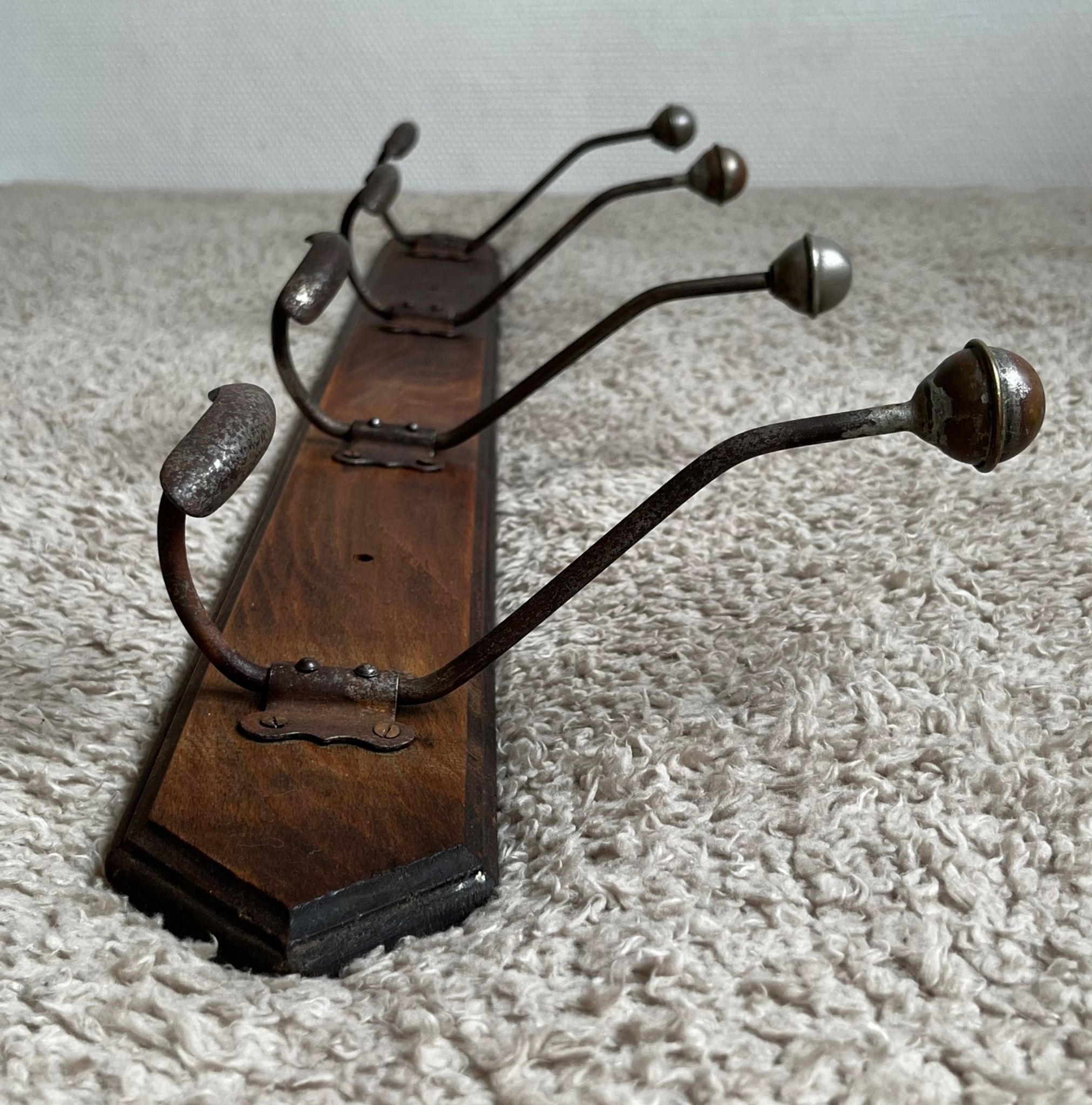 Old coat rack with metal/brass hooks